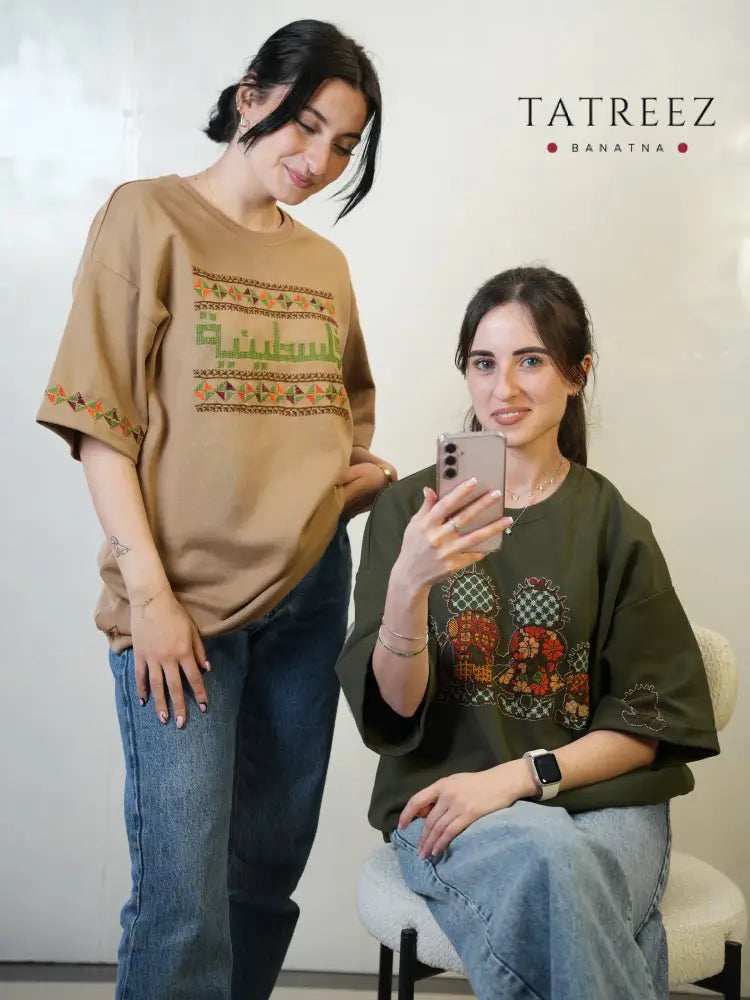 Cotton t-shirt with hand-embroidered Handhala design in Palestinian tatreez, symbol of memory and identity, unisex cultural statement wear