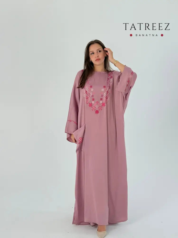 Handmade pink abaya in soft silk with elegant embroidery, offering a classy and free-size design.