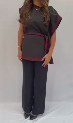 Modern black cut top with a rope design and delicate Palestinian embroidery, made from crepe, displayed with measurements for sizing.