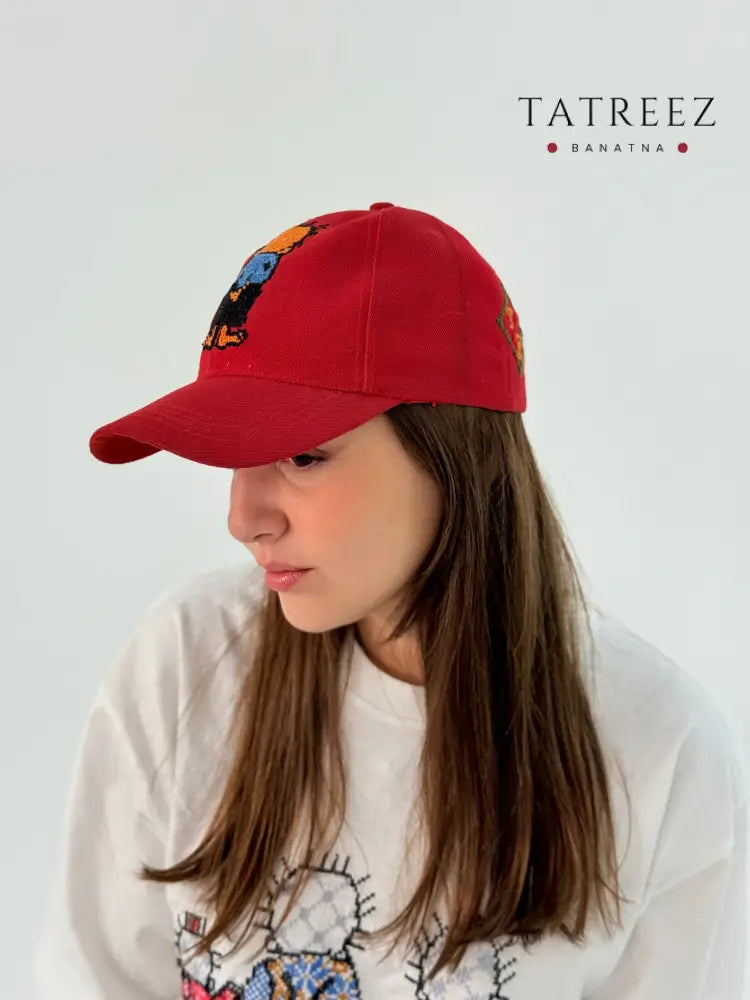 Red cap hat with Hadhala embroidery.
