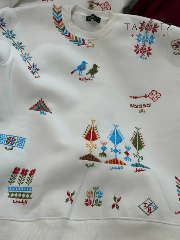 Handmade Stylish White Sweatshirt with Vibrant Palestinian Motifs Clothing & Wearables
