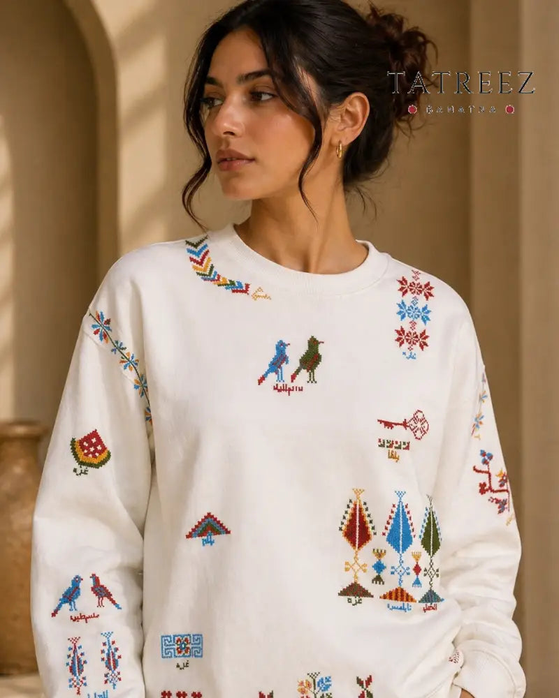 White Sweatshirt – Handmade Vibrant Palestinian Tatreez Motifs - Clothing & Wearables