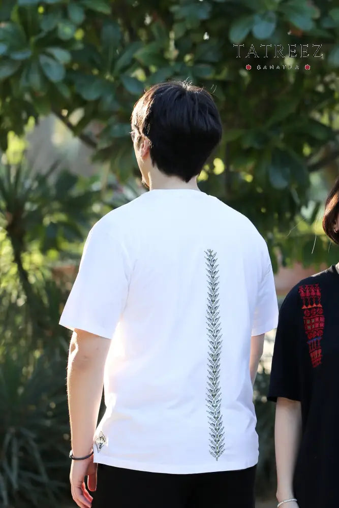 Handmade white unisex t-shirt adorned with an olive tree design on the front and back, representing peace and a connection to nature.
