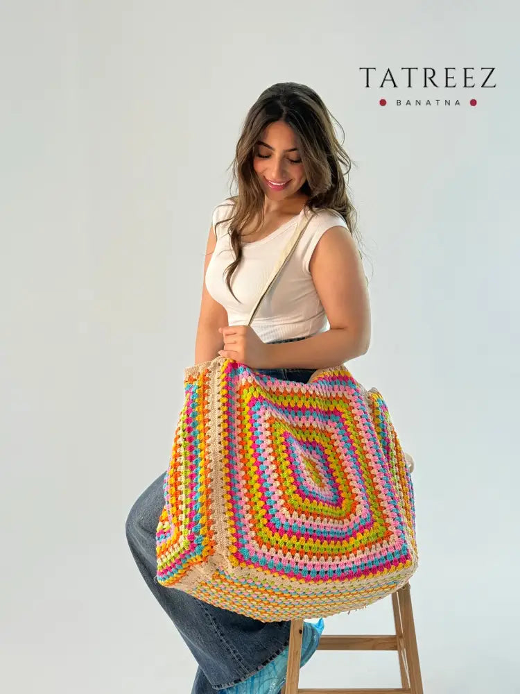 Extra large crochet bag in vibrant colors (yellow, purple, green, beige, and white), showcasing a spacious design perfect for everyday use and stylish outings.